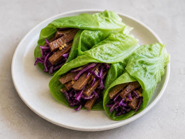 Prepared seitan red cabbage mustard roll-ups